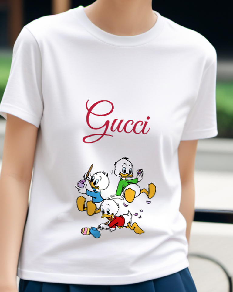 White Three Ducklings Chasing Colorful Egg Graphic T-Shirt - model wearing view