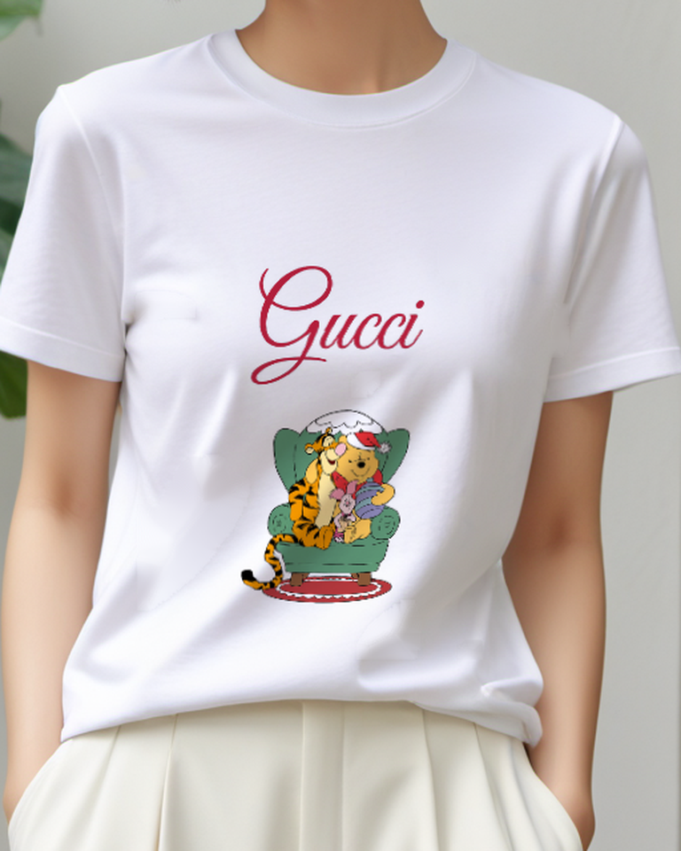White Pooh Piglet And Tigger Sharing A Green Christmas Armchair Graphic T-Shirt - model wearing view