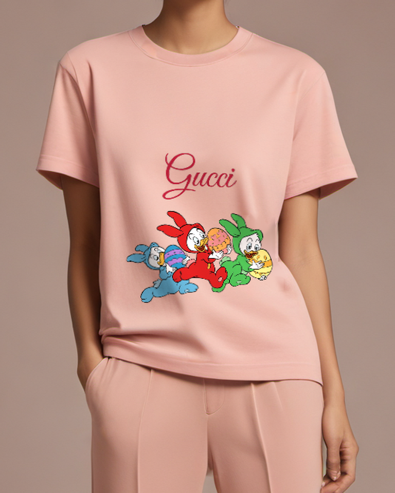 Blush Pink Ducklings In Bunny Suits Holding Eggs Graphic T-Shirt - model wearing view