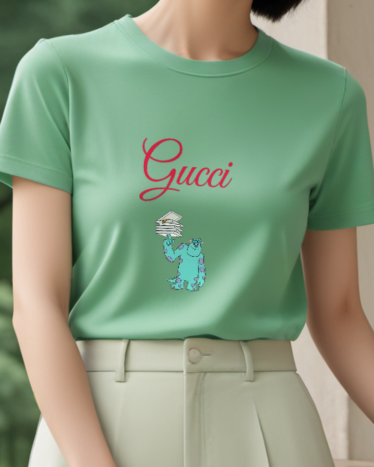 Sage Green Blue Monster Balancing Books Graphic T-Shirt - model wearing view